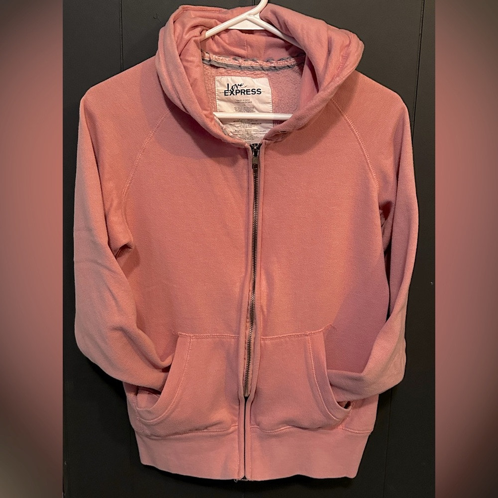 Woman’s pink Express zip up sweater size: large